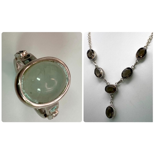 682 - Pairing of Sterling Silver Necklace and Ring.
Necklace features six smoky brown gemstones whilst the... 