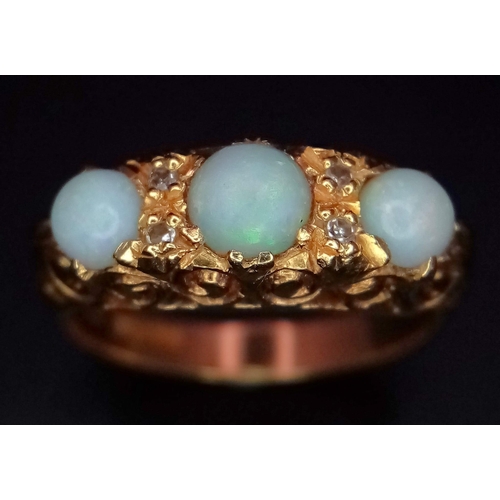 948 - An 18K Yellow Gold Opal and Diamond Ring. Three iridescent opals - 0.8ctw approx with diamond separa... 