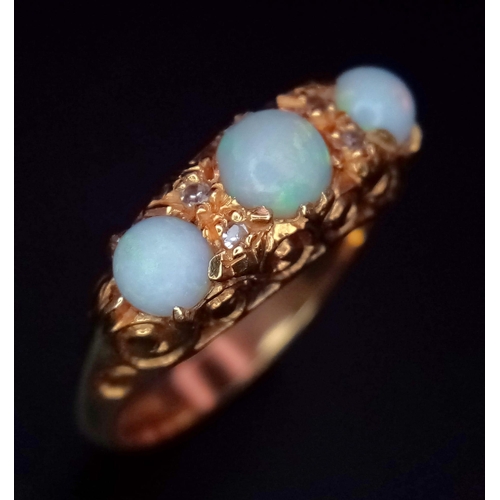 948 - An 18K Yellow Gold Opal and Diamond Ring. Three iridescent opals - 0.8ctw approx with diamond separa... 