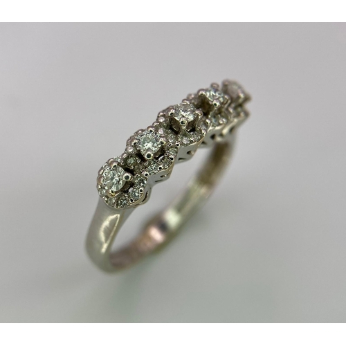 956 - A Vintage 18K White Gold Five Stone Diamond Ring. Five brilliant round cut diamonds each with its ow... 