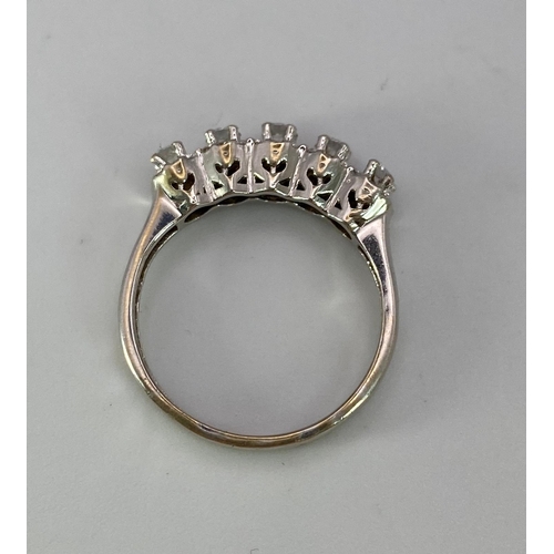 956 - A Vintage 18K White Gold Five Stone Diamond Ring. Five brilliant round cut diamonds each with its ow... 