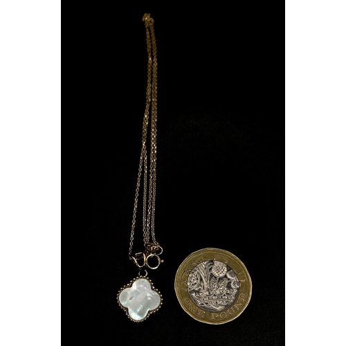 963 - An 18K Gold and Mother of Pearl Clover Pendant on a Disappearing 18K Yellow Gold Necklace. 2cm and 4... 