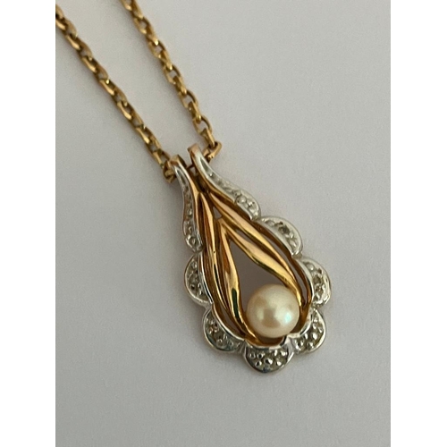 217 - 9 carat WHITE and YELLOW GOLD PENDANT Having pearl detail and mounted on a 9 carat GOLD CHAIN NECKLA... 