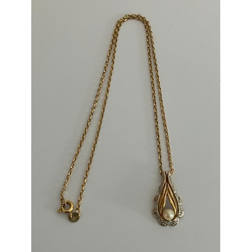 217 - 9 carat WHITE and YELLOW GOLD PENDANT Having pearl detail and mounted on a 9 carat GOLD CHAIN NECKLA... 