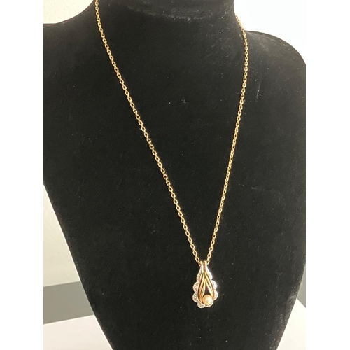 217 - 9 carat WHITE and YELLOW GOLD PENDANT Having pearl detail and mounted on a 9 carat GOLD CHAIN NECKLA... 