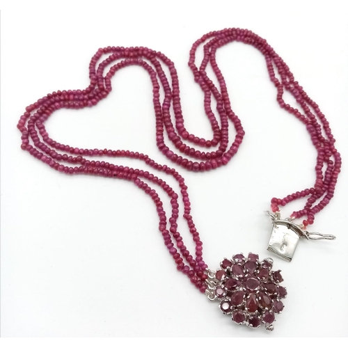 261 - A Three Row African Ruby Gemstone Small Beaded Necklace. Ruby decorative floral clasp. 240ctw. 61g t... 