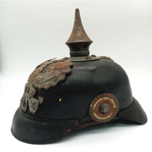 318 - WW1 Pickelhaube helmet. Good condition with insignia.