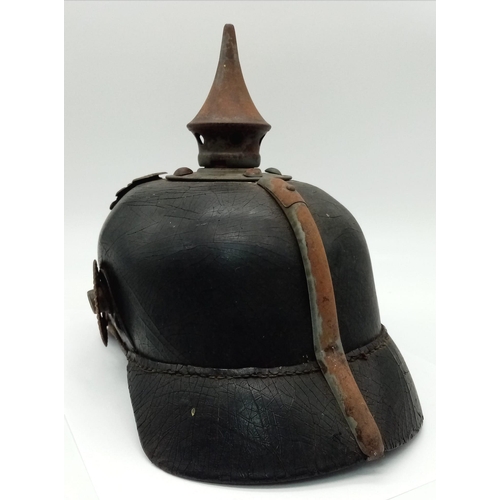 318 - WW1 Pickelhaube helmet. Good condition with insignia.