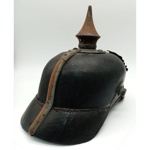 318 - WW1 Pickelhaube helmet. Good condition with insignia.