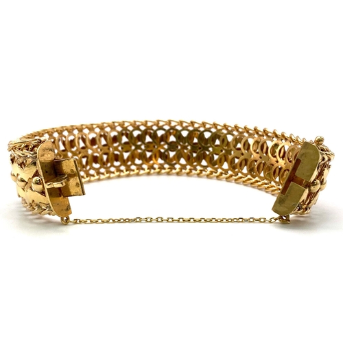 4 - A 9K GOLD INTERLINK BRACELET ORNATE X-FACTOR DESIGN ALSO HAVING A SAFETY CATCH AND SAFETY CHAIN .   ... 