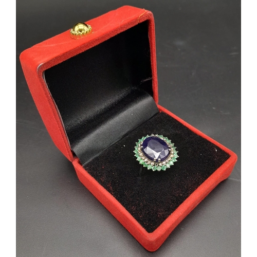 416 - A 9.80ct Oval Blue Sapphire Ring with 3.10ctw Emerald Halo and 0.50ct Diamond inner Halo. Set in 925... 