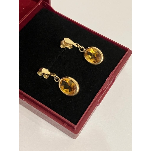 427 - Pair of 9 carat GOLD and CITRINE DROP EARRINGS. Set with oval cut Citrine gemstones and complete wit... 