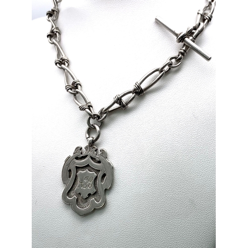 431 - An Antique Sterling Silver Albert Chain with Monogram Fob. 
Hallmarks for Birmingham 1923. 43g weigh... 