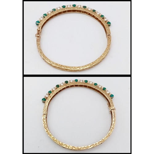 492 - A 14K GOLD HINGED BANGLE DECORATED WITH JADE AND SEED PEARLS WITH OPEN WORK BACK HALF AND NICELY HAN... 