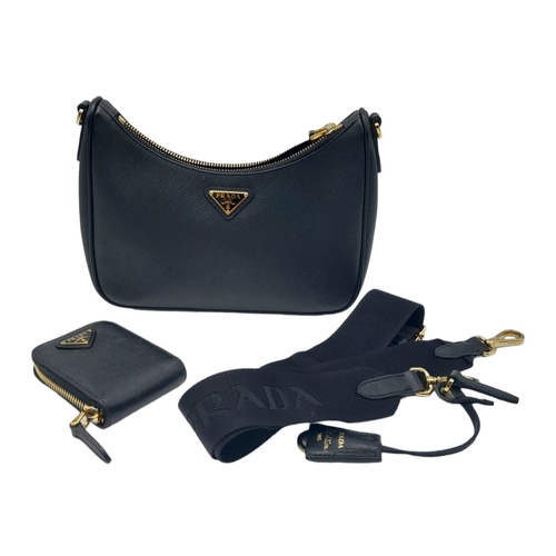 53 - A Prada Black Re-Edition 2005 Mini Bag. Saffiano leather exterior with gold tone hardware, and the i... 