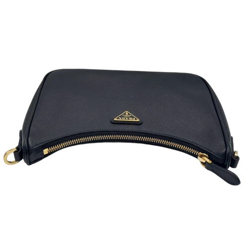 53 - A Prada Black Re-Edition 2005 Mini Bag. Saffiano leather exterior with gold tone hardware, and the i... 