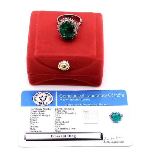 604 - A 6.70ct Oval Emerald Gemstone Ring with 0.75ctw of Diamond Halos. Set in 925 Silver. Size N. 5.75g ... 