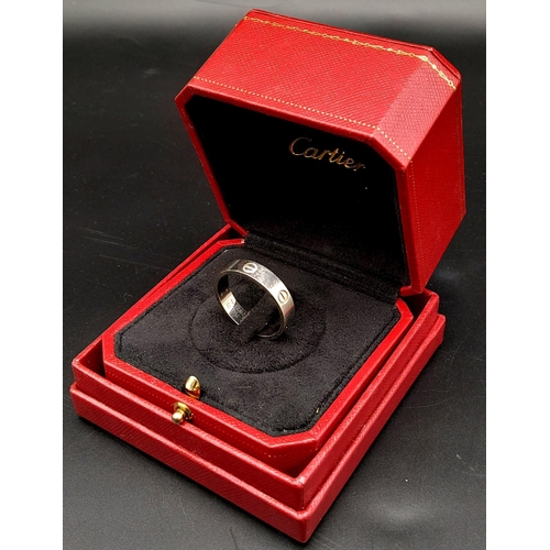 61 - A CARTIER 18K WHITE GOLD GENTS RING IN ORIGINAL BOX WITH CARTIER AUTHENTICTY CERTIFICATE .   8.4gms ... 