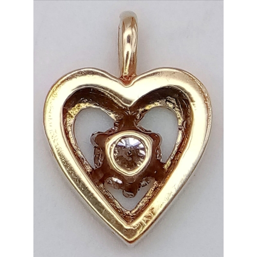 662 - A 9K YELLOW GOLD DIAMOND SET HEART PENDANT 0.20CT 0.9G 15mm x 10mm