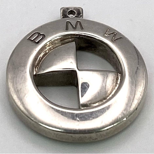 676 - A STERLING SILVER BMW CHARM / PENDANT. IDEAL FOR A KEYRING 24.7G