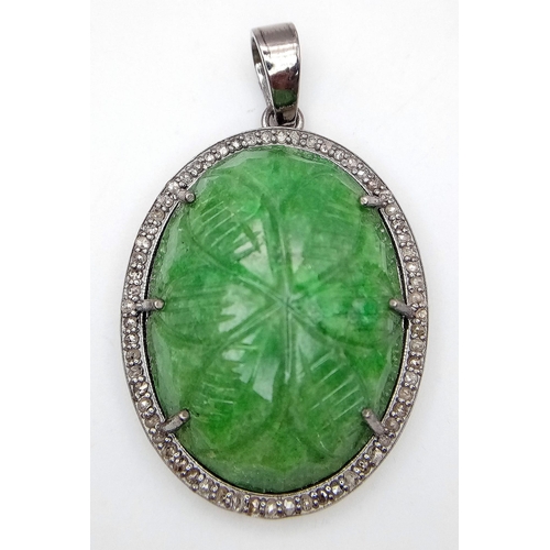 716 - A Hand-Carved Decorative Emerald Pendant with Rose-Cut Diamond Halo. Set in 925 Sterling silver. Eme... 