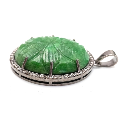 716 - A Hand-Carved Decorative Emerald Pendant with Rose-Cut Diamond Halo. Set in 925 Sterling silver. Eme... 