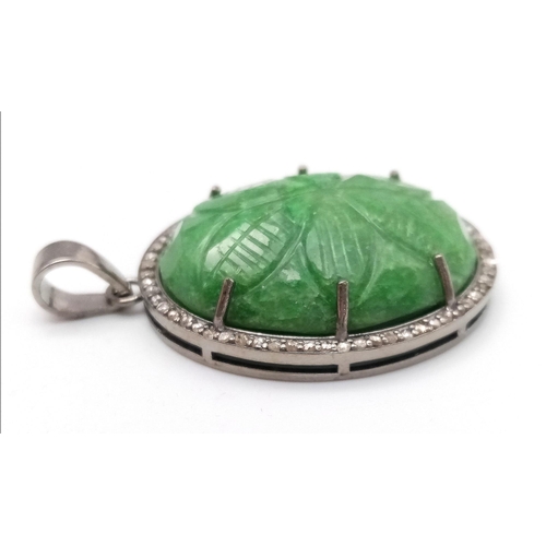 716 - A Hand-Carved Decorative Emerald Pendant with Rose-Cut Diamond Halo. Set in 925 Sterling silver. Eme... 