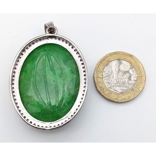 716 - A Hand-Carved Decorative Emerald Pendant with Rose-Cut Diamond Halo. Set in 925 Sterling silver. Eme... 