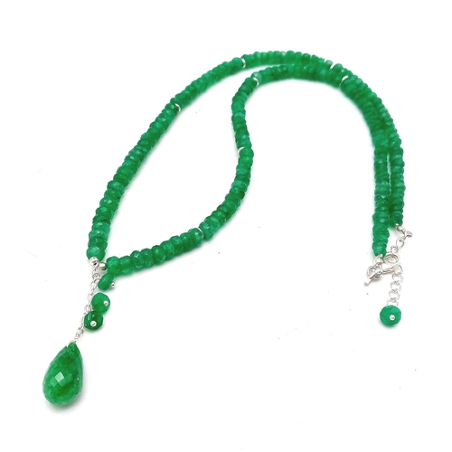 717 - An 80ctw Emerald Small Bead Necklace with Emerald Drop. 925 silver clasp. 42cm necklace length.