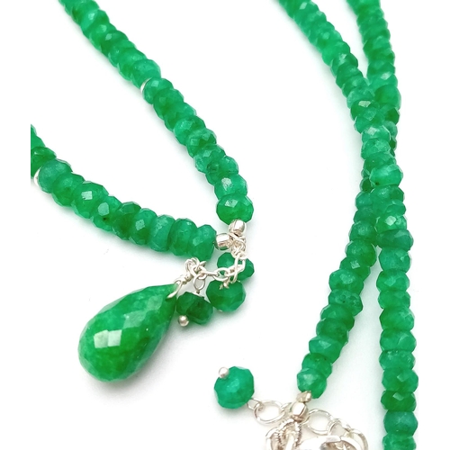 717 - An 80ctw Emerald Small Bead Necklace with Emerald Drop. 925 silver clasp. 42cm necklace length.