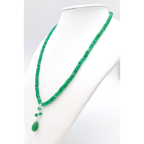 717 - An 80ctw Emerald Small Bead Necklace with Emerald Drop. 925 silver clasp. 42cm necklace length.