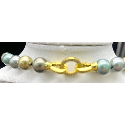 760 - A Multi-Colour South Sea Pearl Shell Bead Necklace with Gilded Clasp. Gilded, blue and silver 10mm b... 