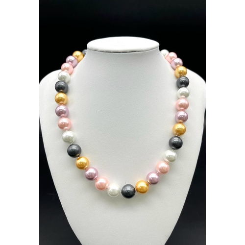 822 - A Vivid Multi-Coloured South Sea Pearl Shell Large Bead Necklace. 12mm beads. 44cm necklace length.