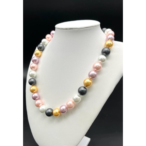 822 - A Vivid Multi-Coloured South Sea Pearl Shell Large Bead Necklace. 12mm beads. 44cm necklace length.