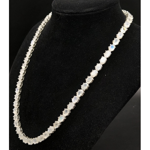 892 - A Serious Moonstone Tennis Necklace set in 925 Silver. 46cm length. 37.83g total weight.