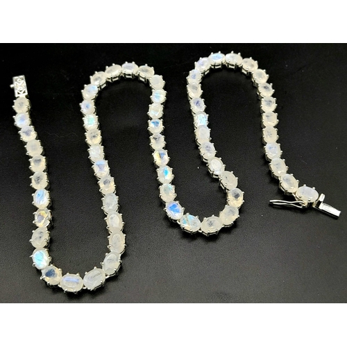 892 - A Serious Moonstone Tennis Necklace set in 925 Silver. 46cm length. 37.83g total weight.