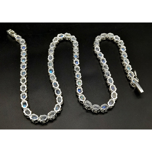 892 - A Serious Moonstone Tennis Necklace set in 925 Silver. 46cm length. 37.83g total weight.