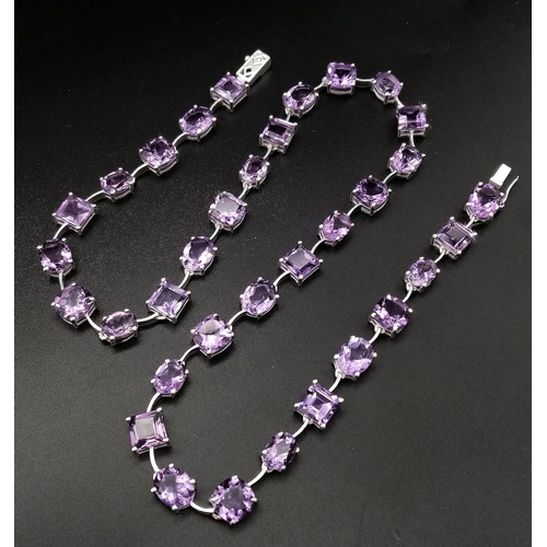 912 - An Amethyst Gemstone Tennis Necklace set in 925 Silver.
46cm length. Square and oval shapes. 32.37g ... 