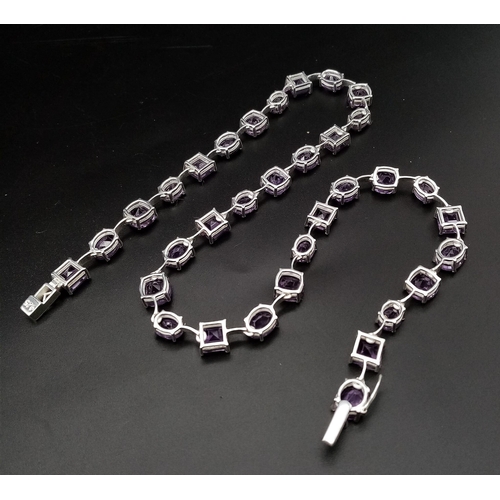 912 - An Amethyst Gemstone Tennis Necklace set in 925 Silver.
46cm length. Square and oval shapes. 32.37g ... 