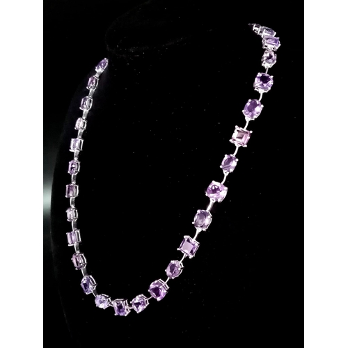 912 - An Amethyst Gemstone Tennis Necklace set in 925 Silver.
46cm length. Square and oval shapes. 32.37g ... 