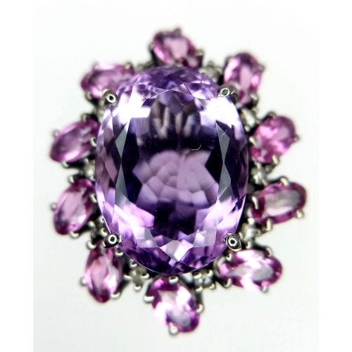 128 - An Amethyst and Rhodolite 925 Silver Ring with Rose cut Diamond Accents. Amethyst - 13.55ctw. Diamon... 