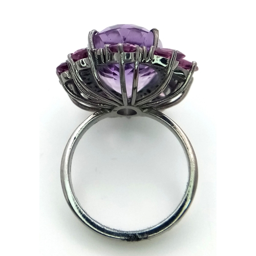 128 - An Amethyst and Rhodolite 925 Silver Ring with Rose cut Diamond Accents. Amethyst - 13.55ctw. Diamon... 