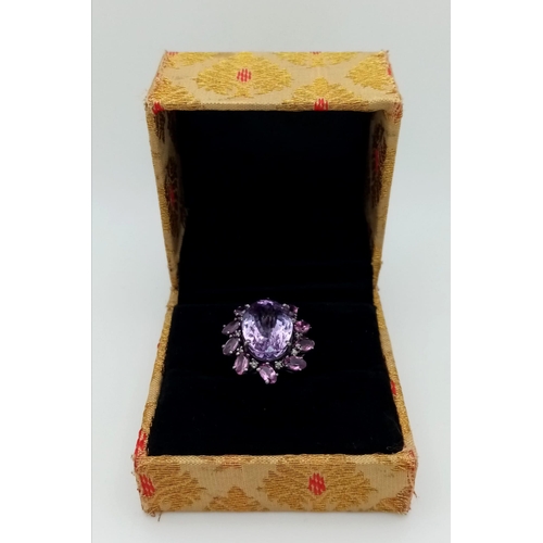 128 - An Amethyst and Rhodolite 925 Silver Ring with Rose cut Diamond Accents. Amethyst - 13.55ctw. Diamon... 