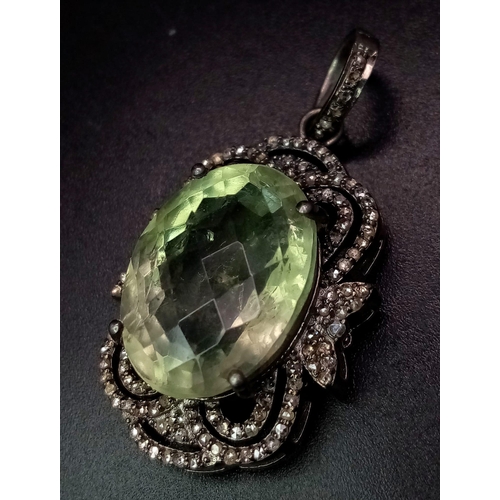 254 - An Art Deco Style Green Amethyst and Diamond Pendant set in 925 Silver. Oval faceted-cut. Green Amet... 