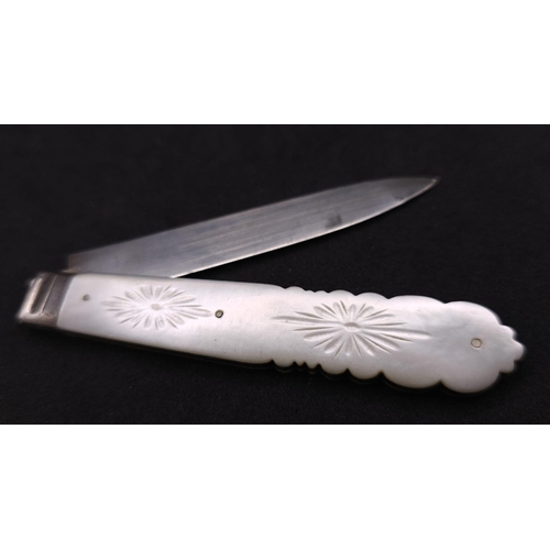 374 - An Antique Sterling Silver Fruit Knife. Decorative mother of pearl handle. Hallmarks for Sheffield 1... 