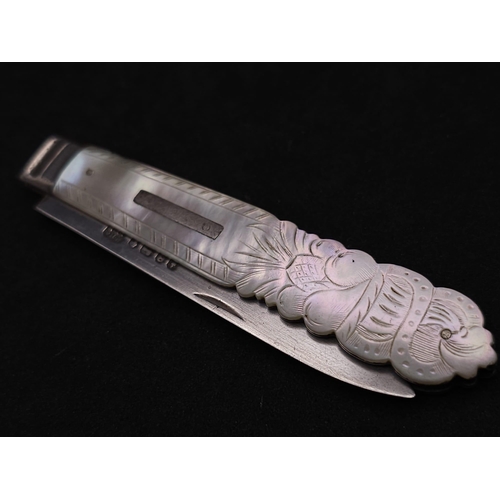 374 - An Antique Sterling Silver Fruit Knife. Decorative mother of pearl handle. Hallmarks for Sheffield 1... 