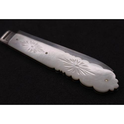 374 - An Antique Sterling Silver Fruit Knife. Decorative mother of pearl handle. Hallmarks for Sheffield 1... 