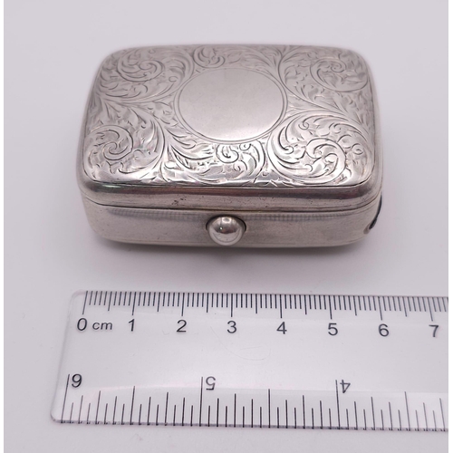 381 - An Antique Sterling Silver Vesta Case . Scroll engraved lid with empty cartouche. Hinge works well. ... 