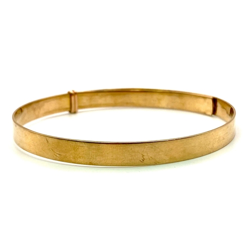 387 - A 9K GOLD ADJUSTABLE BELT STYLE BANGLE .16.8gms