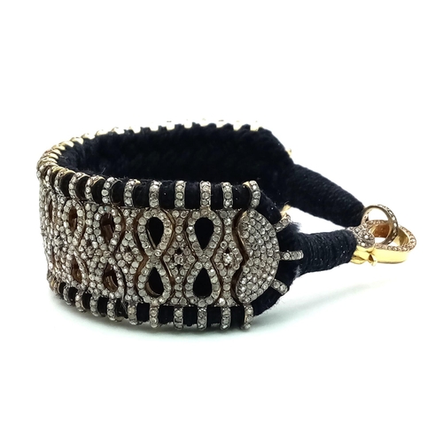 43 - A Brilliantly Unique Handcrafted Designer Diamond Bracelet. A black woven textile bracelet strap ado... 